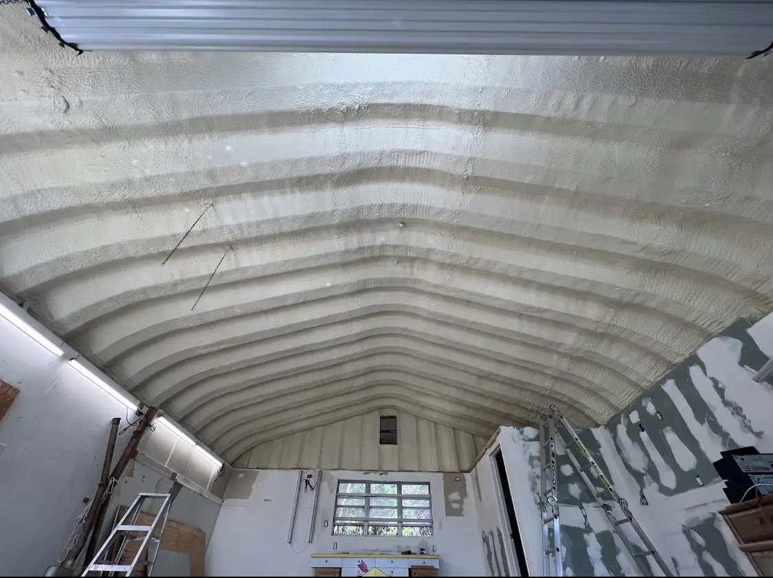 Spray polyurethane foam applied to the underside of a metal roof deck in Somerdale